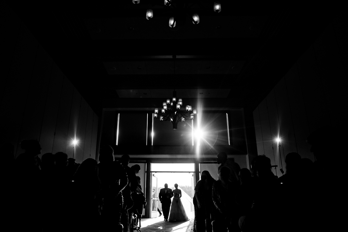 dramatic black and white photo of the bride entering their liberty mountain wedding ceremony