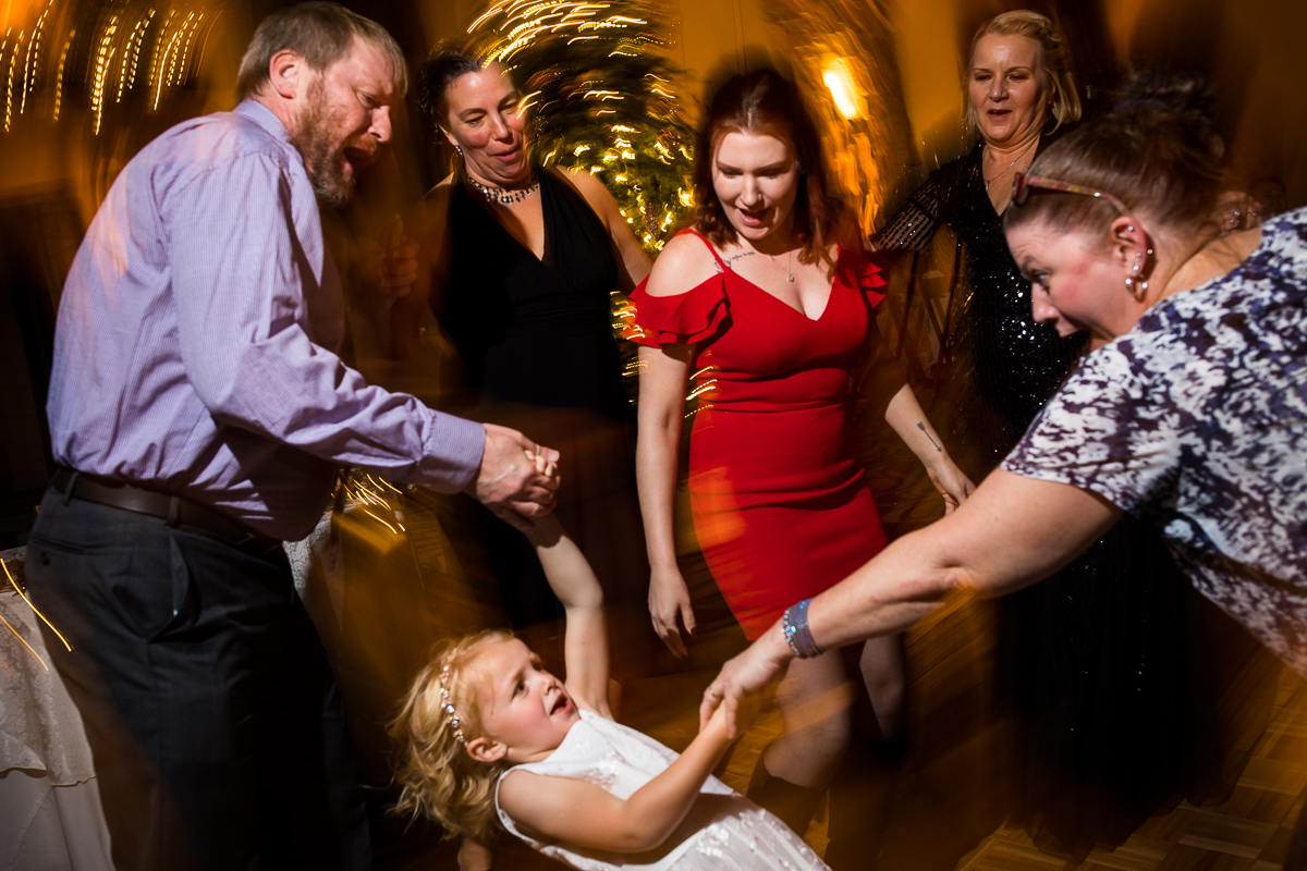 unique, creative image of guest dancing with the flower girl during this liberty mountain resort wedding reception with creative, unique wedding photography done by lisa rhinehart photography 