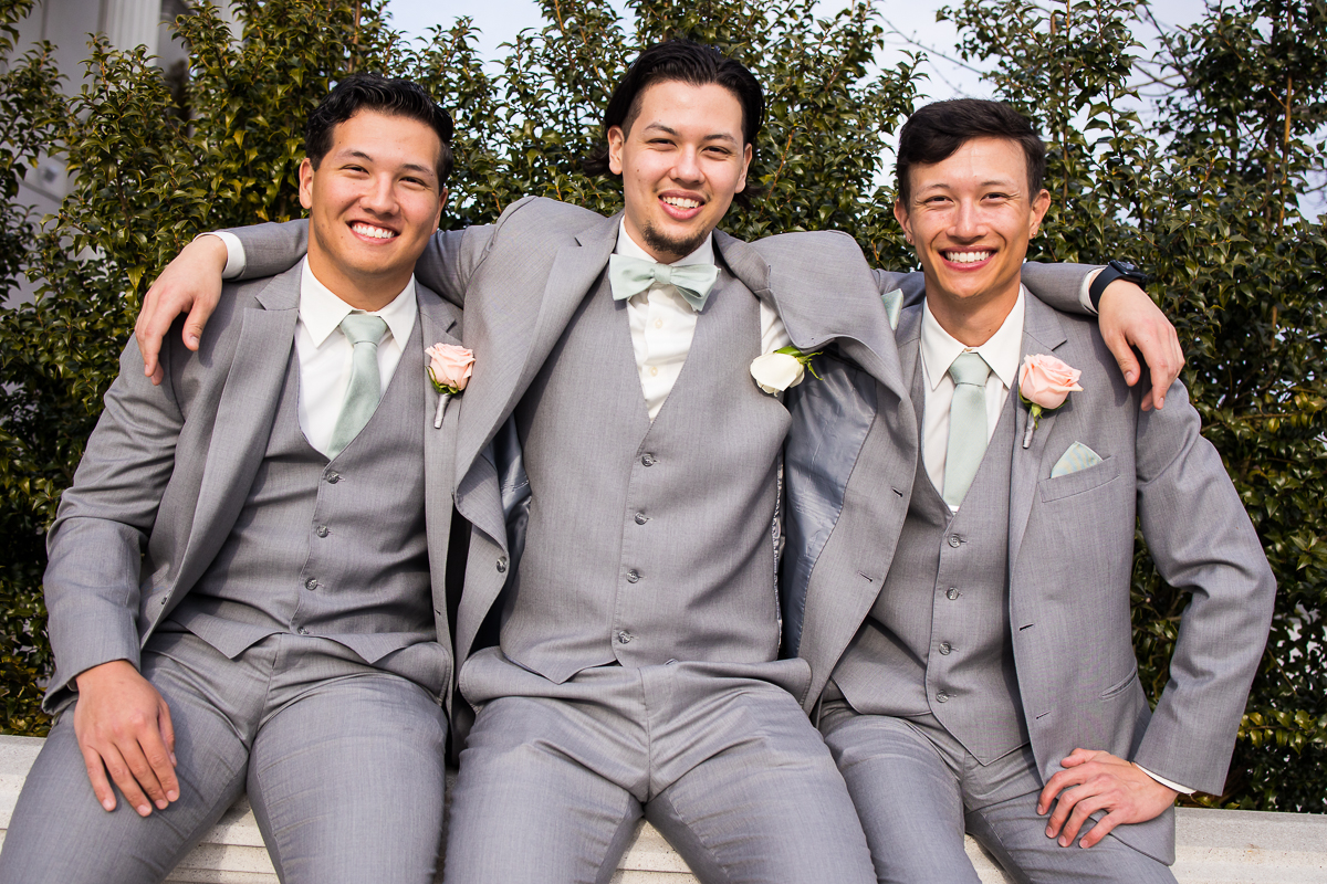 light, airy, vibrant image of the groom with his groomsmen before the wedding ceremony at the palace