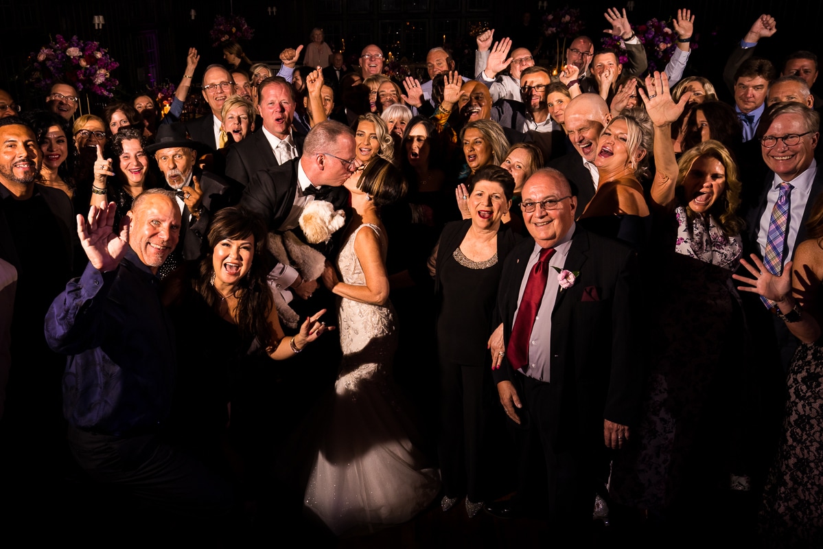 group photo of the bride and groom and all their guests from their Harrisburg civic club wedding reception