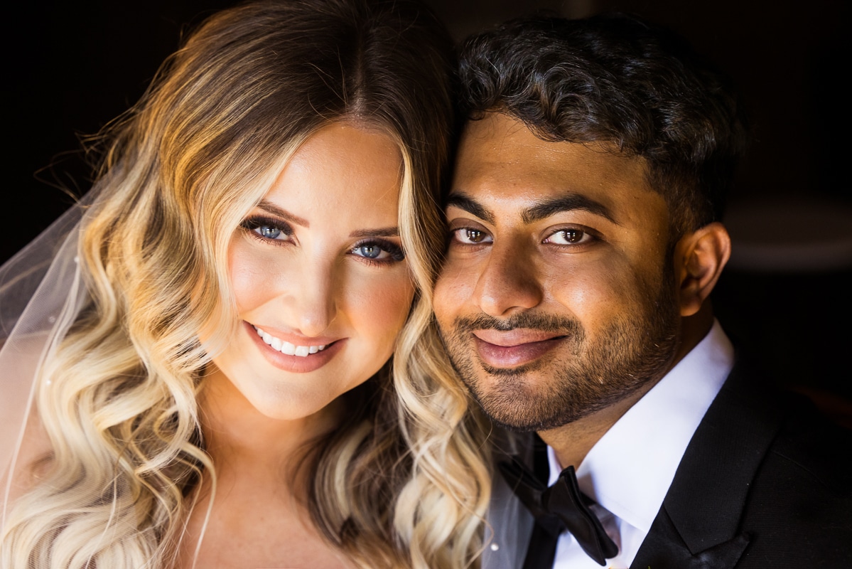 mechanicsburg wedding photographer, lisa rhinehart, captures this traditional close up portrait of the bride and the groom close together as they smile toward the camera 
