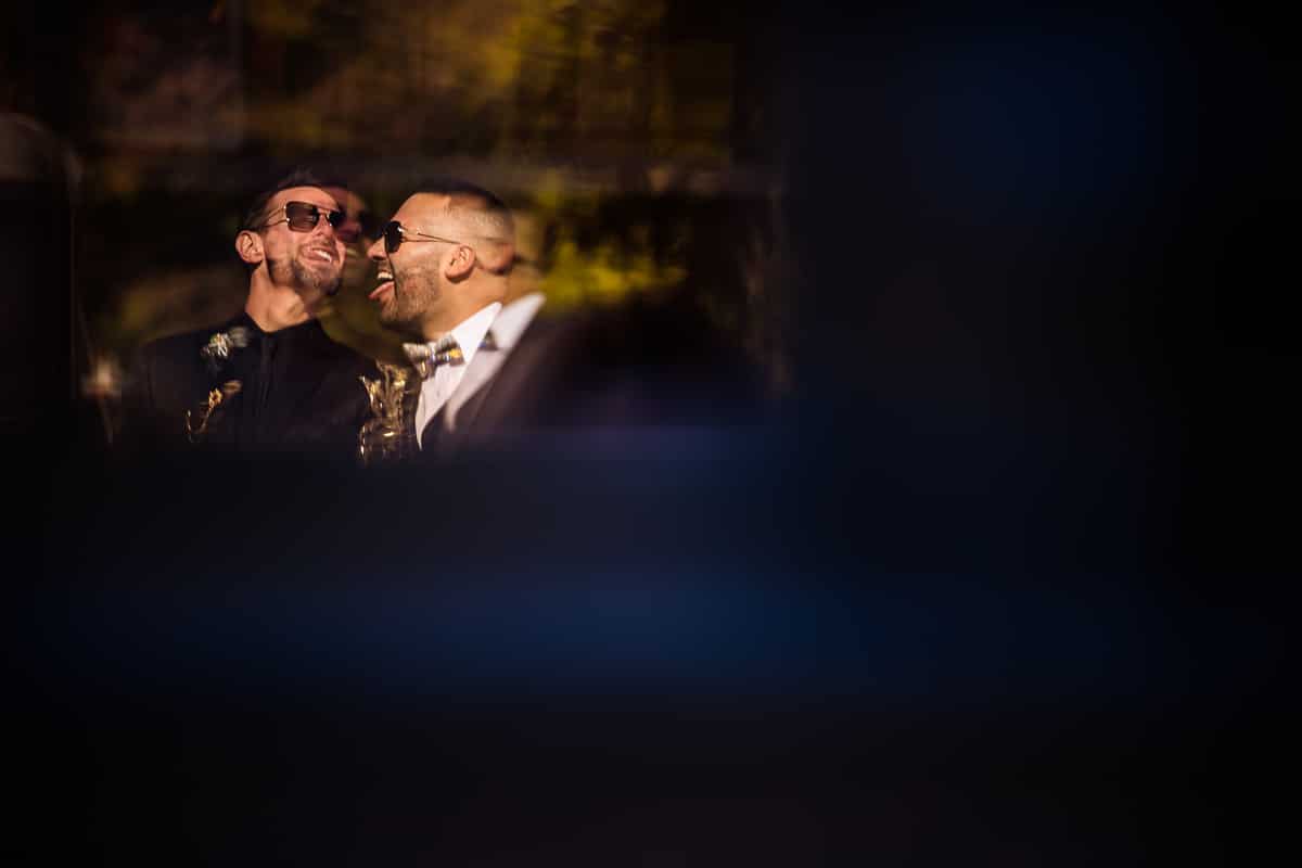 Philadelphia wedding photographer, Lisa Rhinehart, captures this unique, creative image of the couple in a reflection before their Phoenixville Foundry wedding 