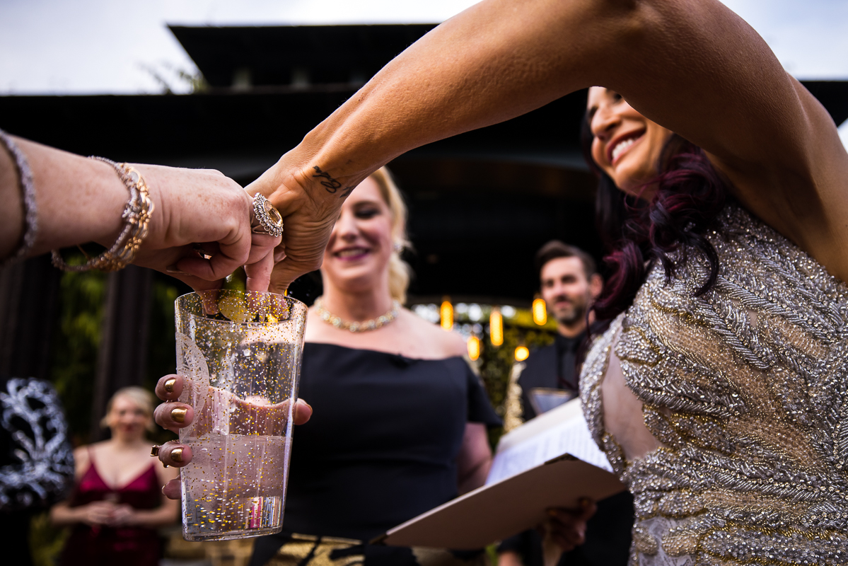 image of the moms mixing a drink together during the wedding ceremony at the Phoenixville foundry 