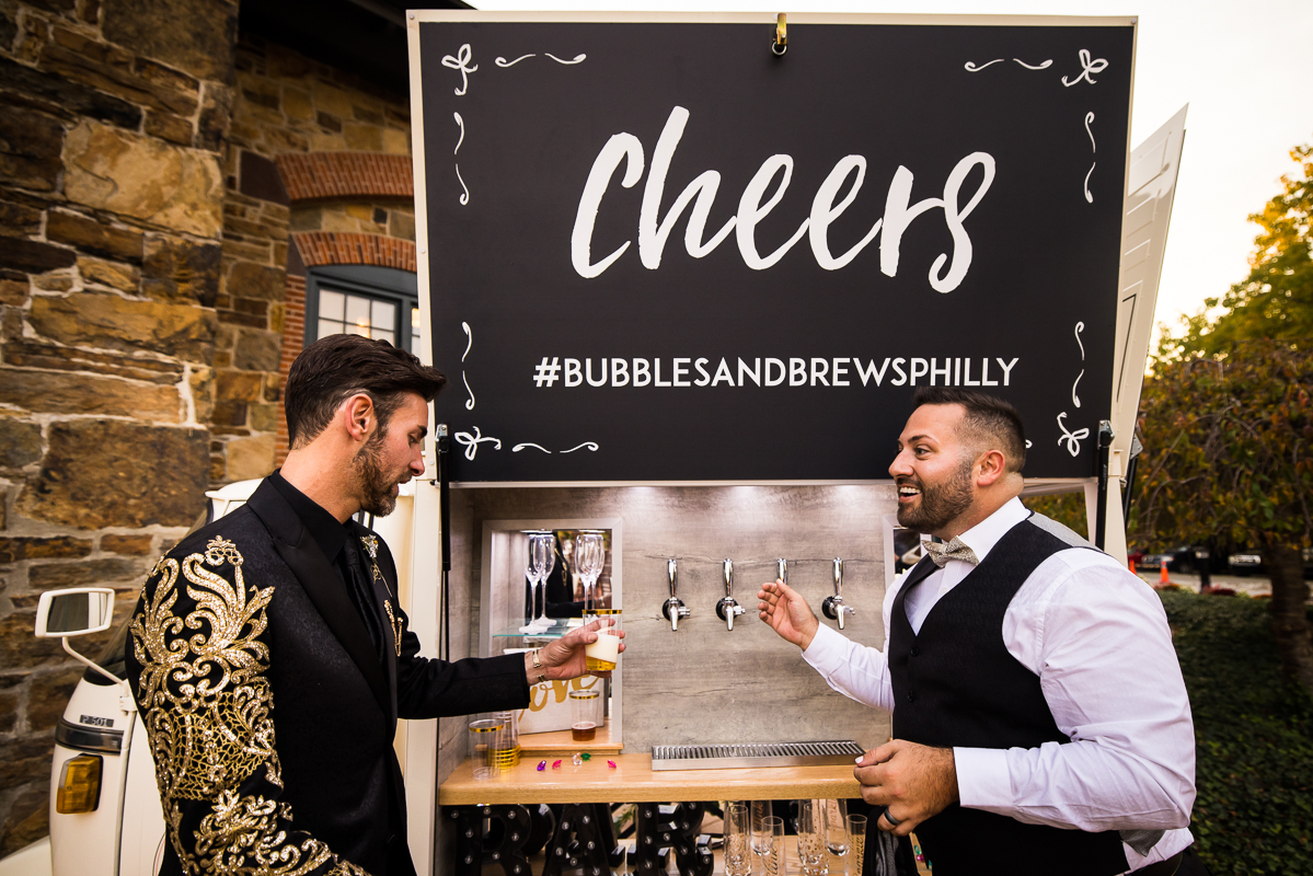 image of the husbands getting drinks from the bubbles and brews cart in Philadelphia, pa 