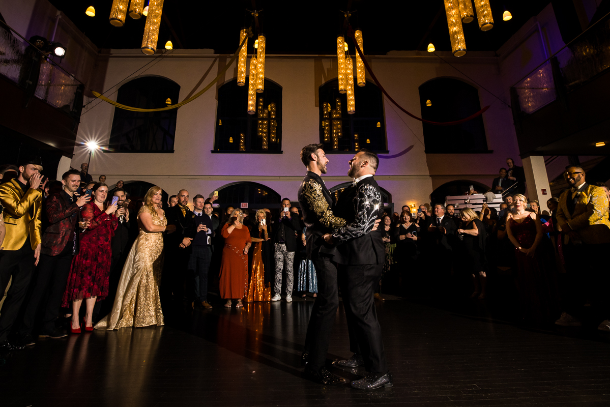 LGBT Wedding Photographer, Lisa Rhinehart, captures the new husbands first dance inside of the Phoenixville foundry in Philadelphia, PA