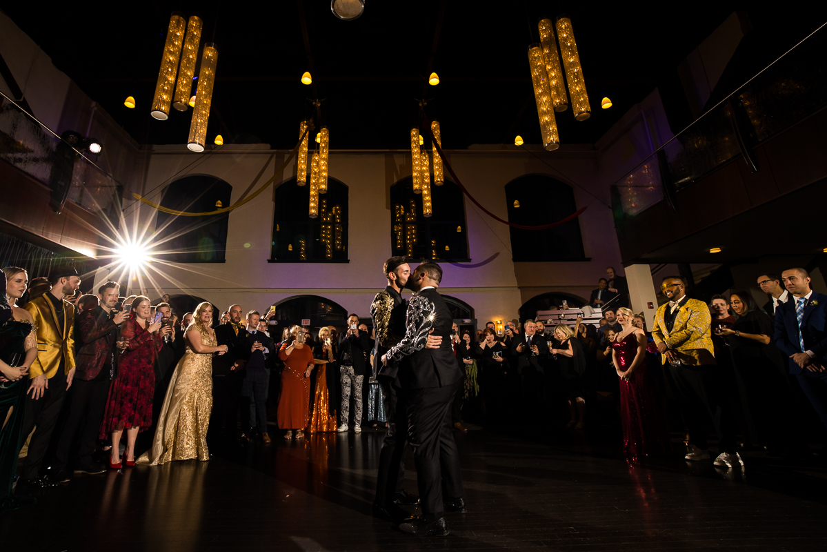 LGBT Wedding Photographer, Lisa Rhinehart, captures the couple's first dance and their kiss at the Phoenixville foundry in Philadelphia, pa 