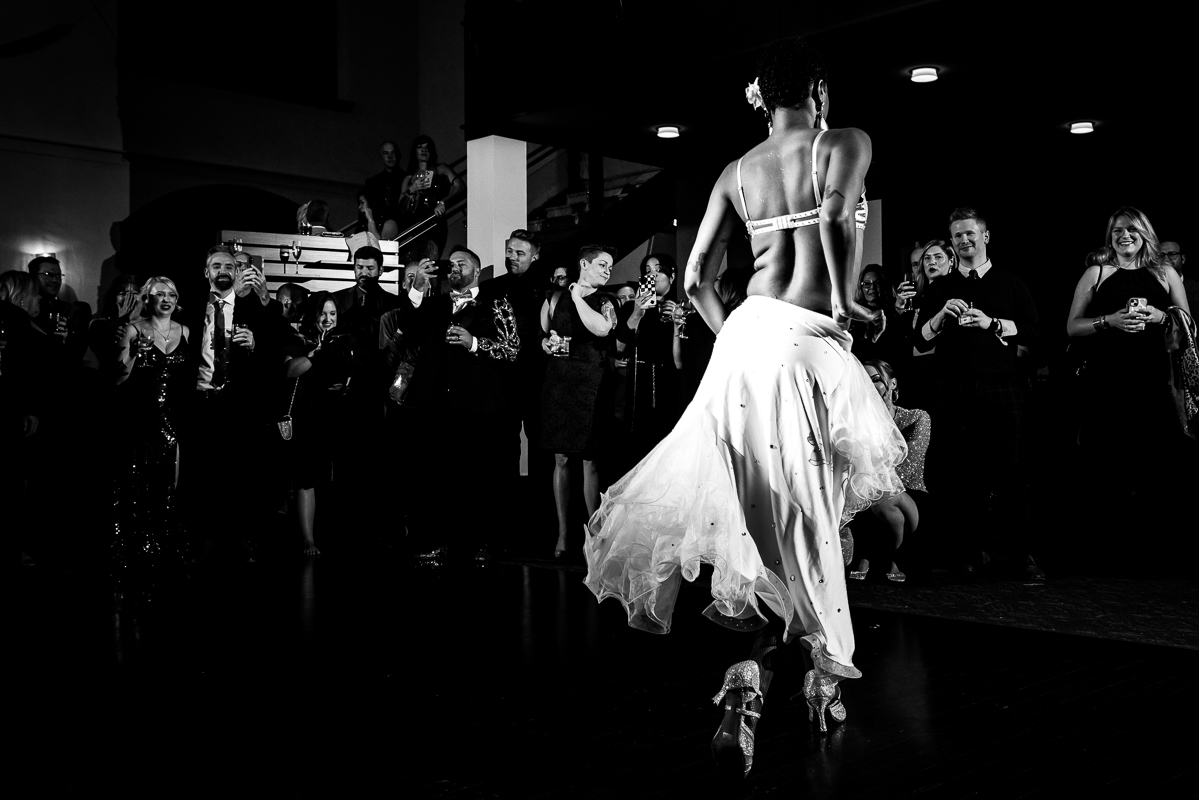 black and white image of one of the burlesque dancers dancing at the wedding reception in Philadelphia, pa 