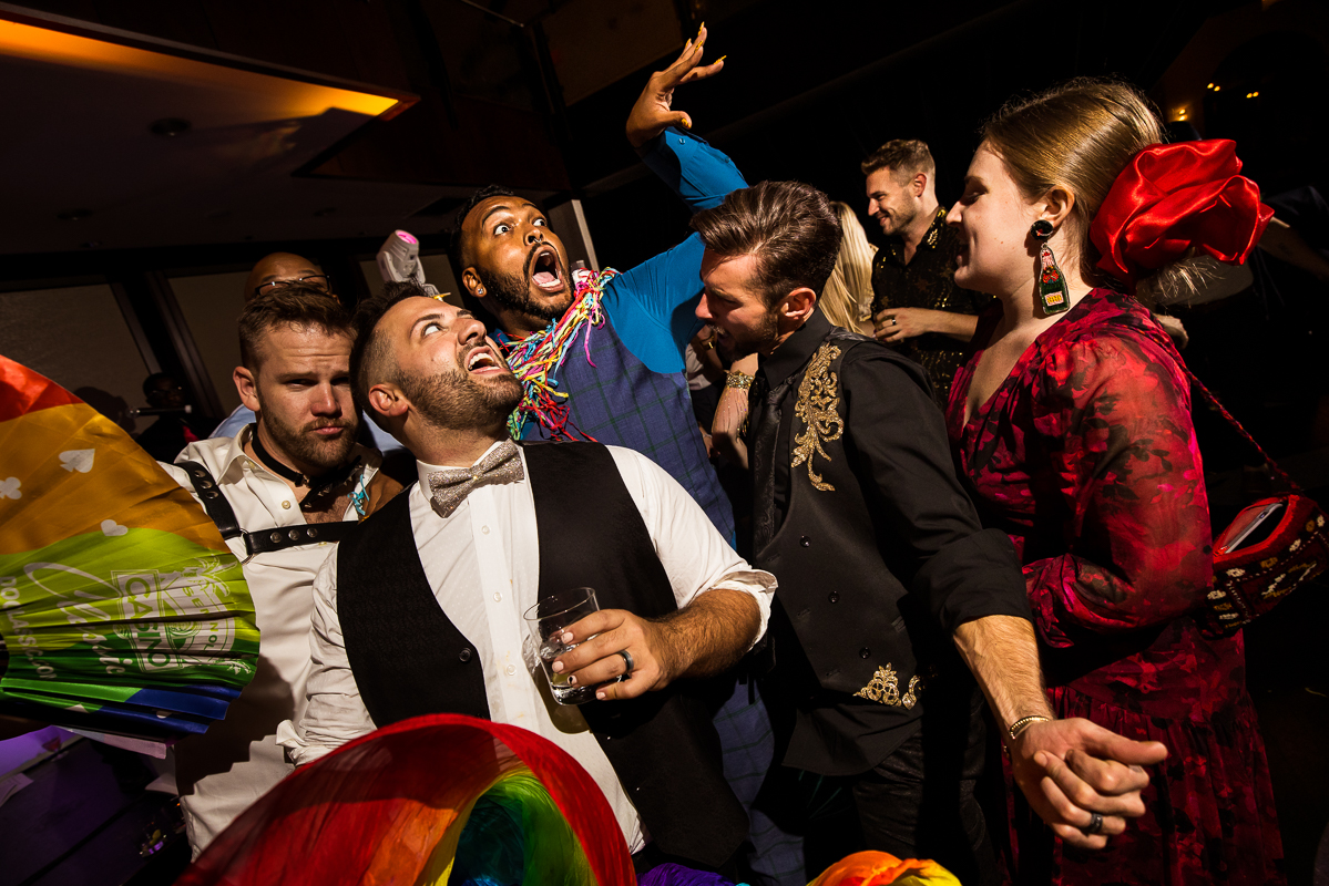 LGBT Wedding Photographer, Lisa Rhinehart, captures the husbands and guests as they start to have fun and dance during the wedding reception in Philadelphia, pa 