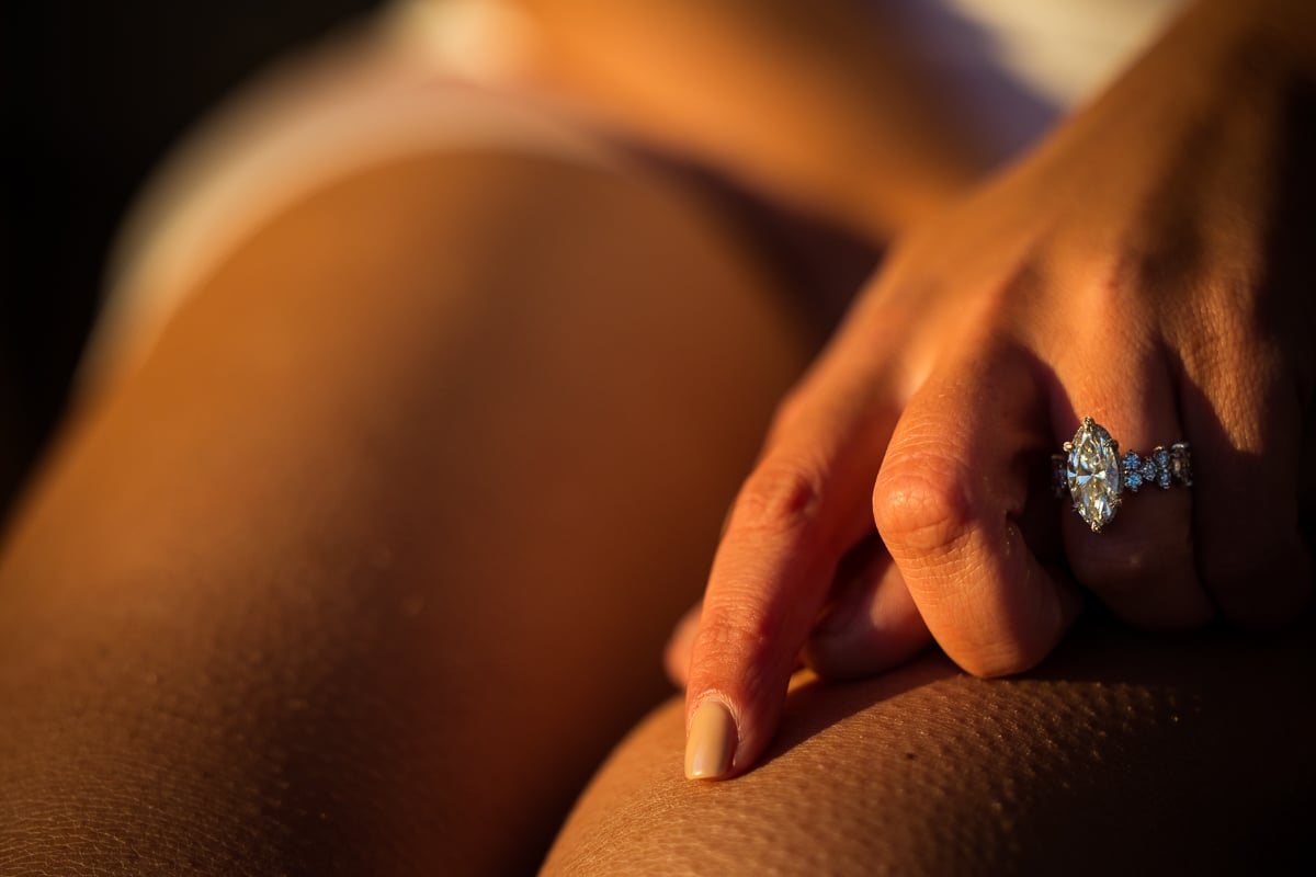 Ashcombe Mansion Engagement photographer, Lisa Rhinehart, captures the future brides big, gorgeous ring and the goosebumps on her legs
