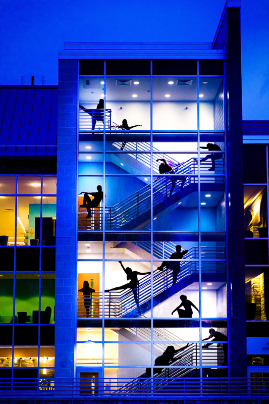 unique, creative fun image of dancers in the library stairwell for this branding photography session