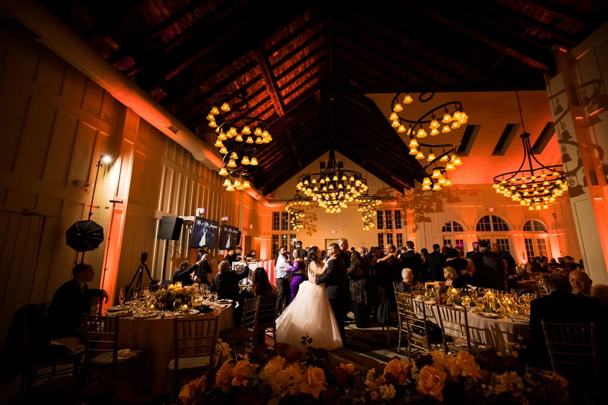 Ryland Inn Wedding Photographer, lisa rhinehart, captures the first dance of the couple as red light fills the room ceiling and walls during the fall wedding 