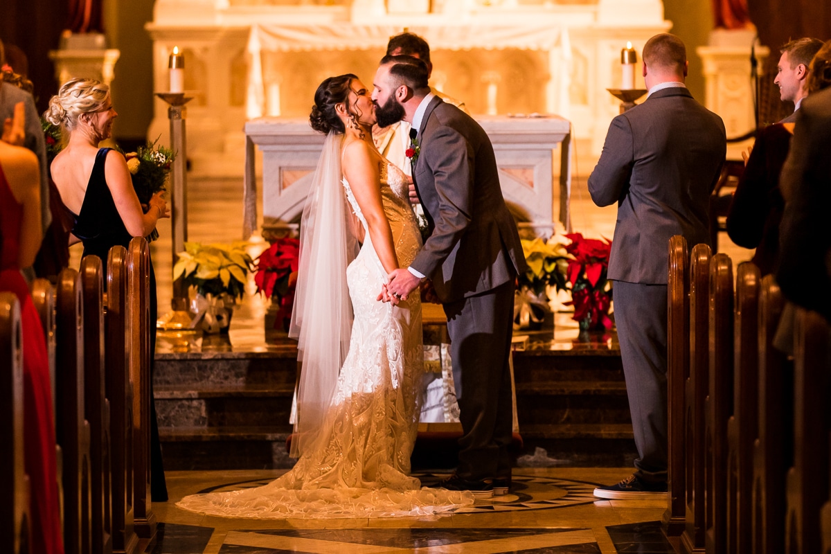 mount st marys wedding photographer, lisa rhinehart, captures the couples first kiss during their Gettysburg Hotel Wedding