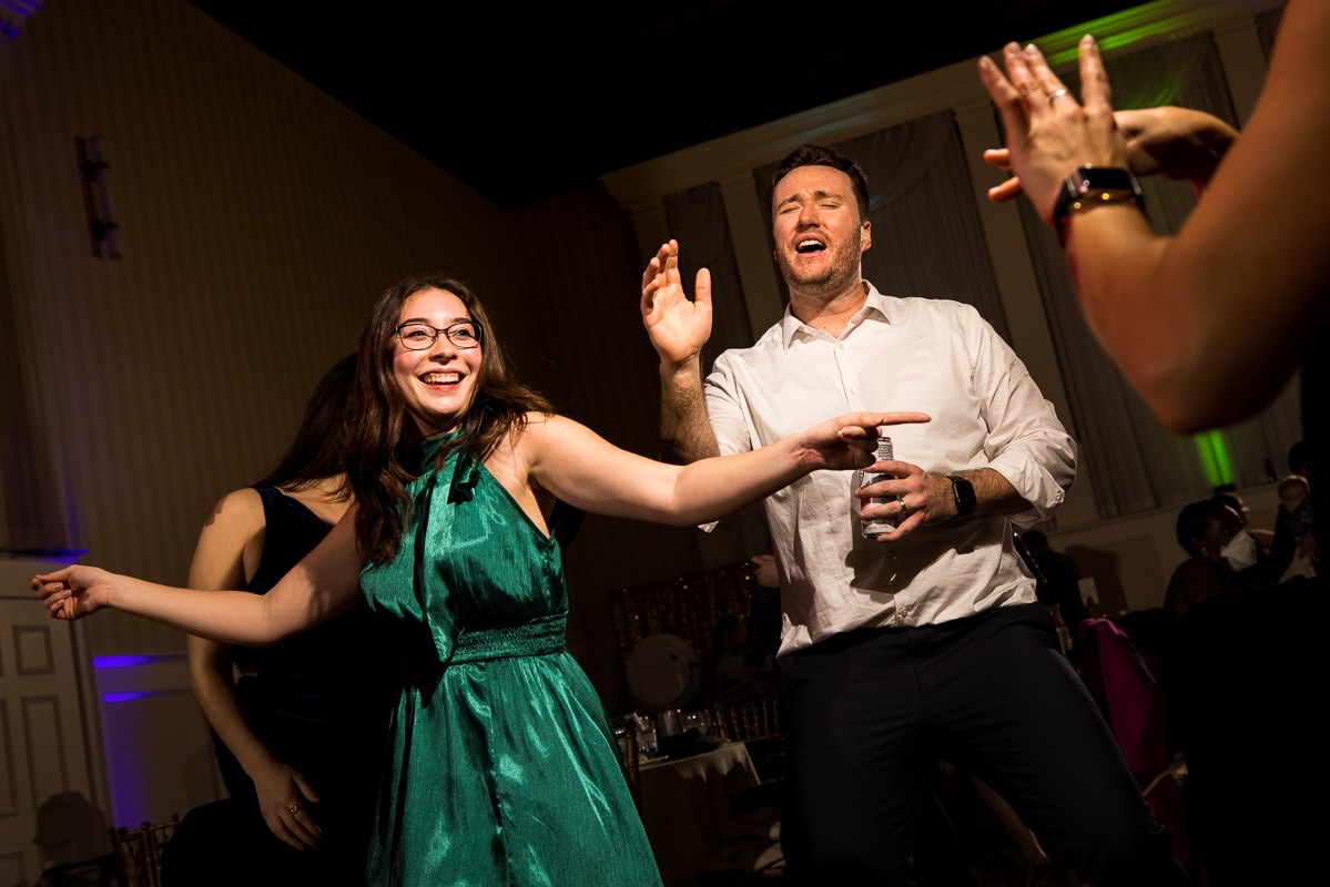 fun, vibrant, colorful image of guests dancing and singing at this Gettysburg hotel reception 