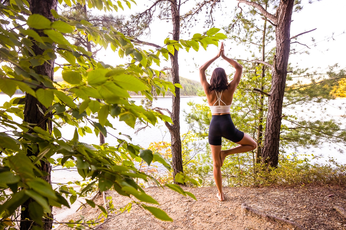 natural, unique, authentic, creative business branding image of a woman doing yoga in the woods to create an authentic image for her business brand in long pine reservior in Chambersburg pa 