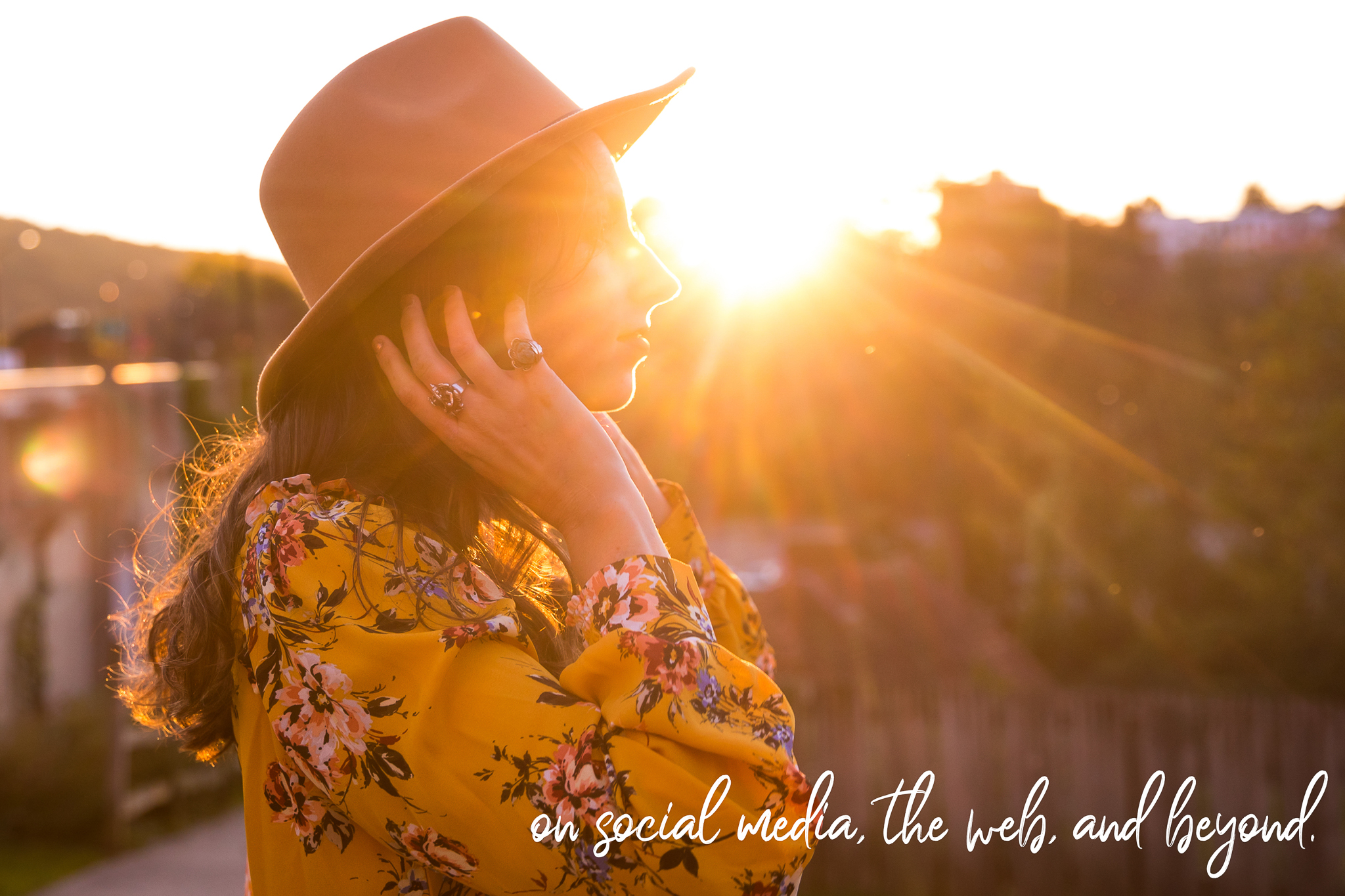 Image of a travel blogger looking off into the distance as the sun is setting during this Personal branding for female entrepreneurs