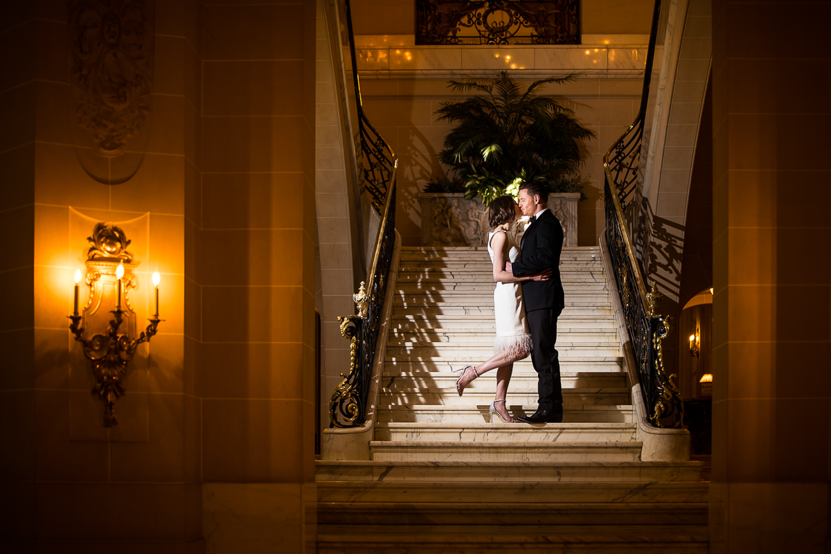 Perry Belmont House Wedding Photographer, lisa rhinehart, captures this elegant, authentic, unique image of the bride and groom kissing on the grand staircase inside of this Washington dc wedding venue 