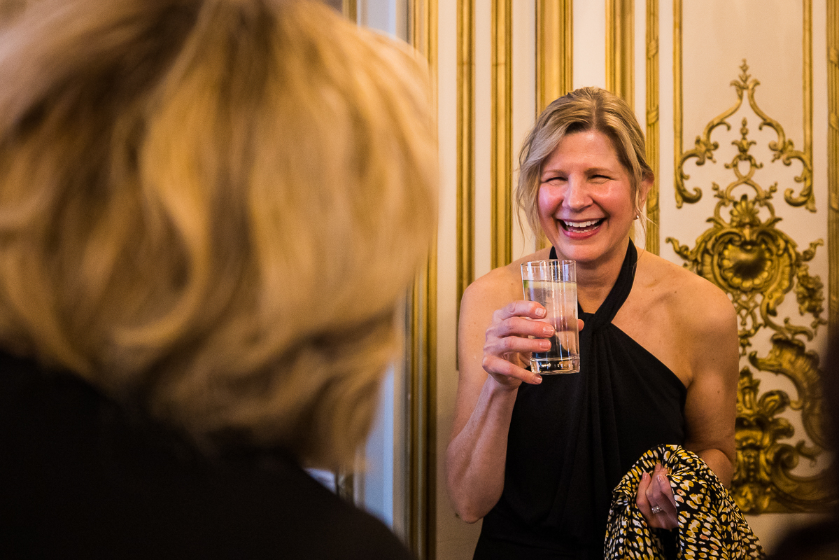 lisa rhinehart, dc wedding photographer, captures candid images of guests as they are drinking and laughing during cocktail hour 
