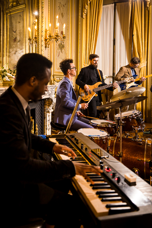 wedding photographer, rhinehart photography, captures this creative fun image of the band as they plan live music during this wedding reception in dc 