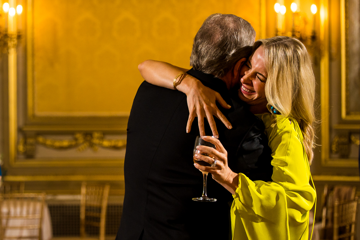 image of guests hugging one another inside of this elegant, stunning dc wedding venue 