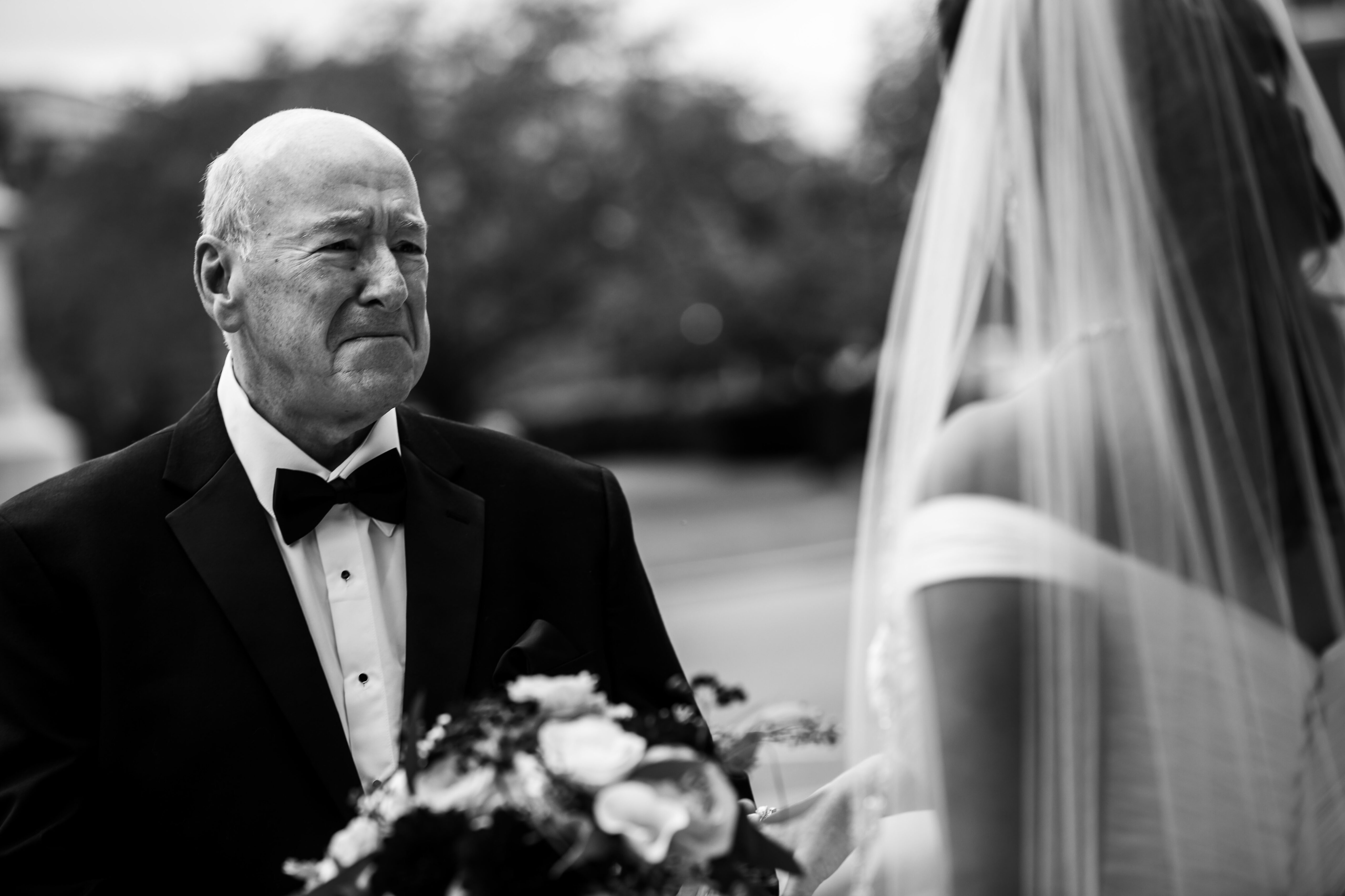 Authentic DC Wedding Photographer, Lisa Rhinehart, captures this authentic image of the father of the bride as he sees her wearing her gown for the first time with tears in his eyes