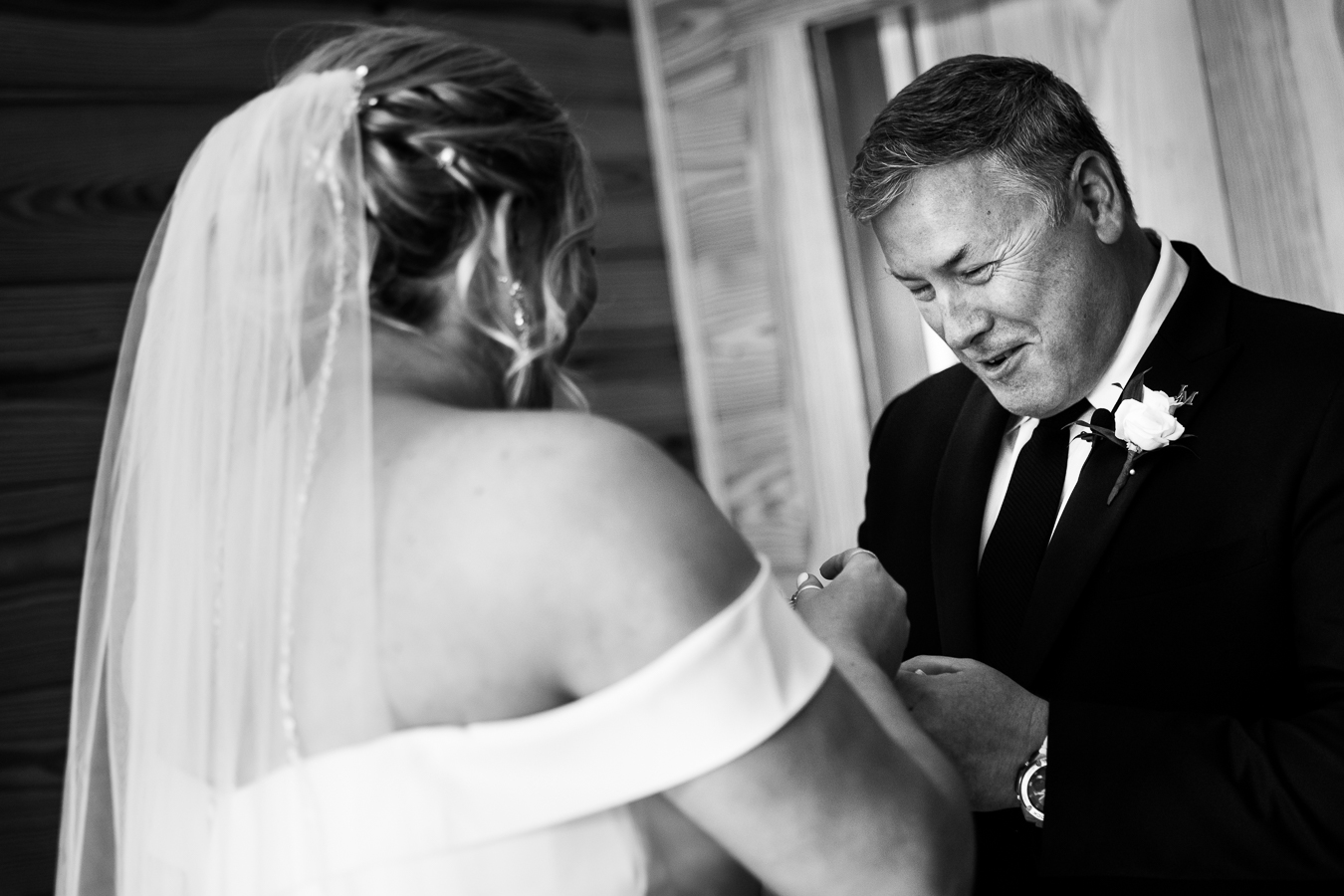 Middleburg Barn Wedding Photographer, lisa rhinehart, captures this black and white image of the father of the bride smiling at his daughter as he sees her for the first time in her wedding gown before her wedding ceremony in Virginia 
