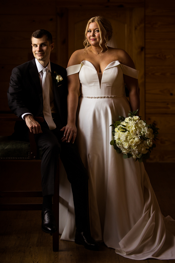 traditional portrait of the bride and groom as they stand beside one another for romantic portraits before their virginia wedding ceremony 