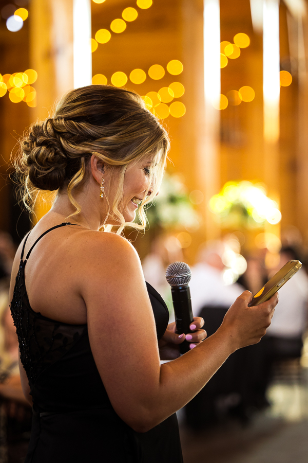 creative, colorful, unique image of a bridesmaid giving a speech during the wedding reception captures by Middleburg Barn Wedding Photographer, lisa rhinehart