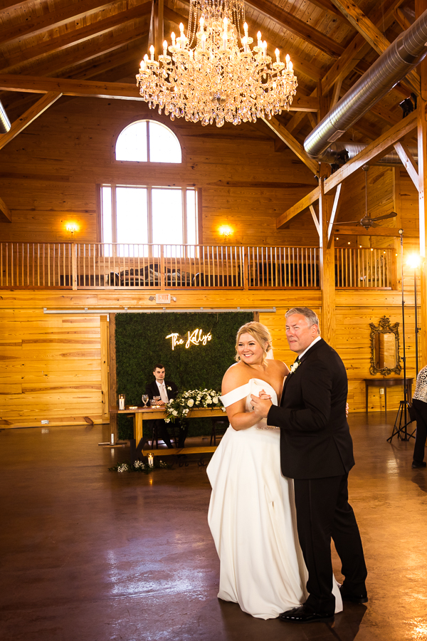 virginia wedding photographer, rhinehart photography, captures the bride and her father sharing their father daughter dance during the wedding reception at the middleburg barn 