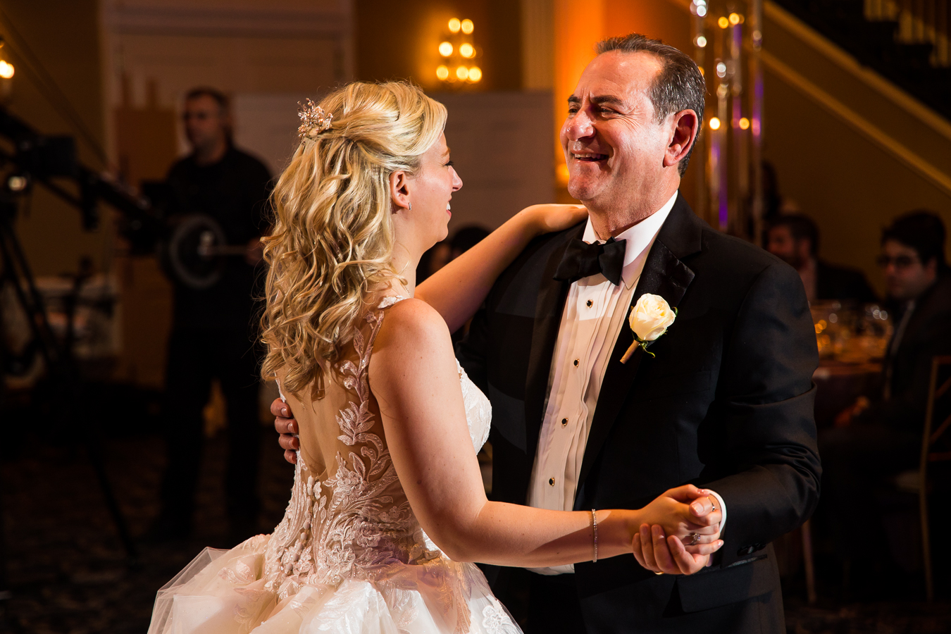 new jersey wedding photographer, lisa rhinehart, captures this authentic, loving image of the bride and her father sharing their father daughter dance during the wedding reception at the palace at somerset park 