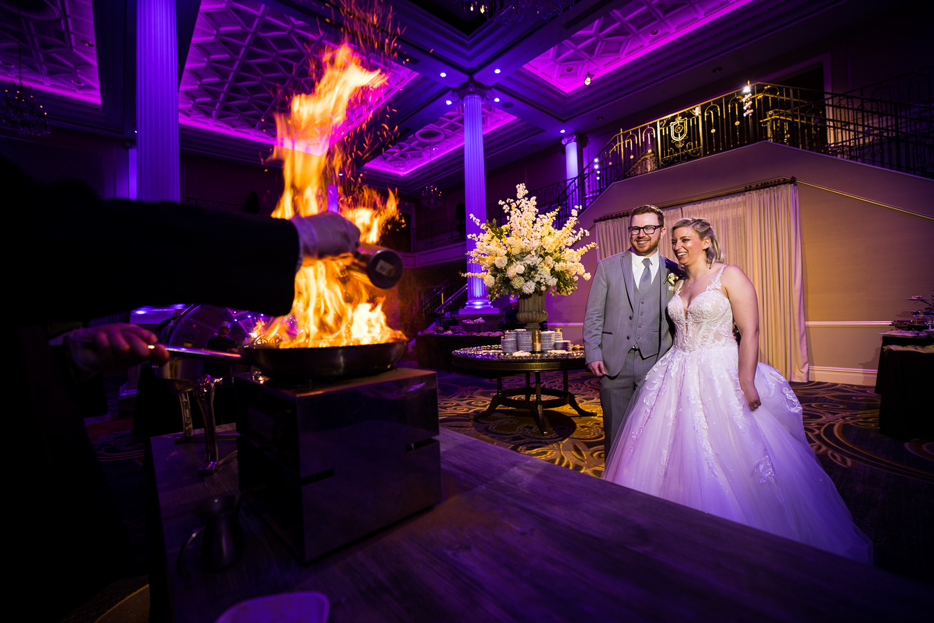 Wedding Photographer, lisa rhinehart, captures this creative image of the bride and groom as they stand next to one another watching the fire inside of the palace at somerset park 