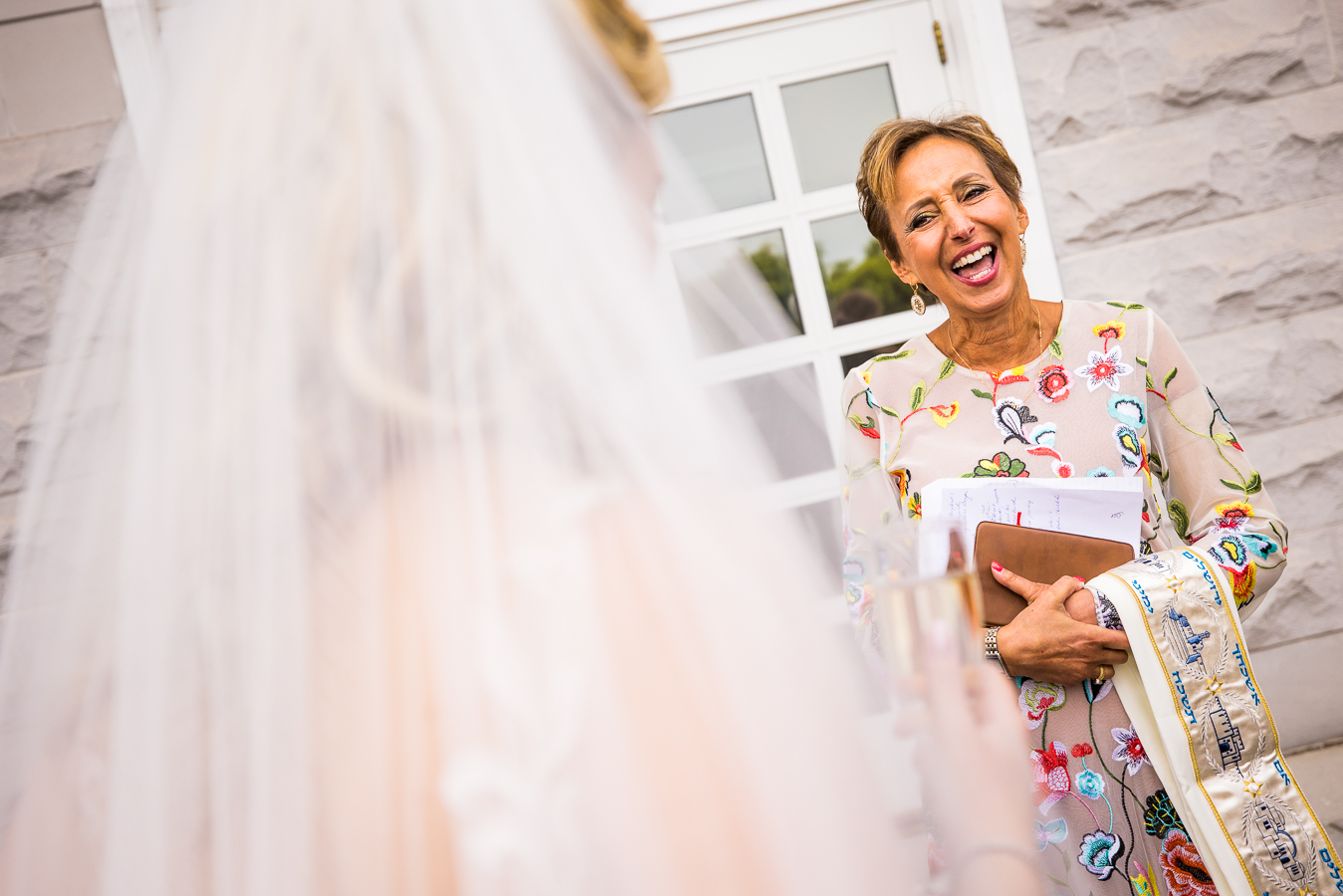 image of this lady in a bright colorful dress for this wedding ceremony at the palace at somerset park 