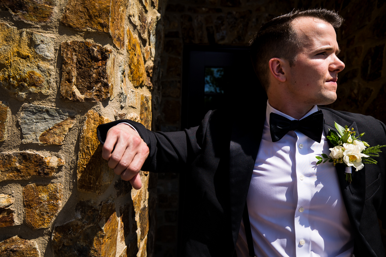 best pa wedding photographer, lisa rhinehart, captures this creative but traditional image of the groom looking off into the distance for his portraits before the wedding ceremony 