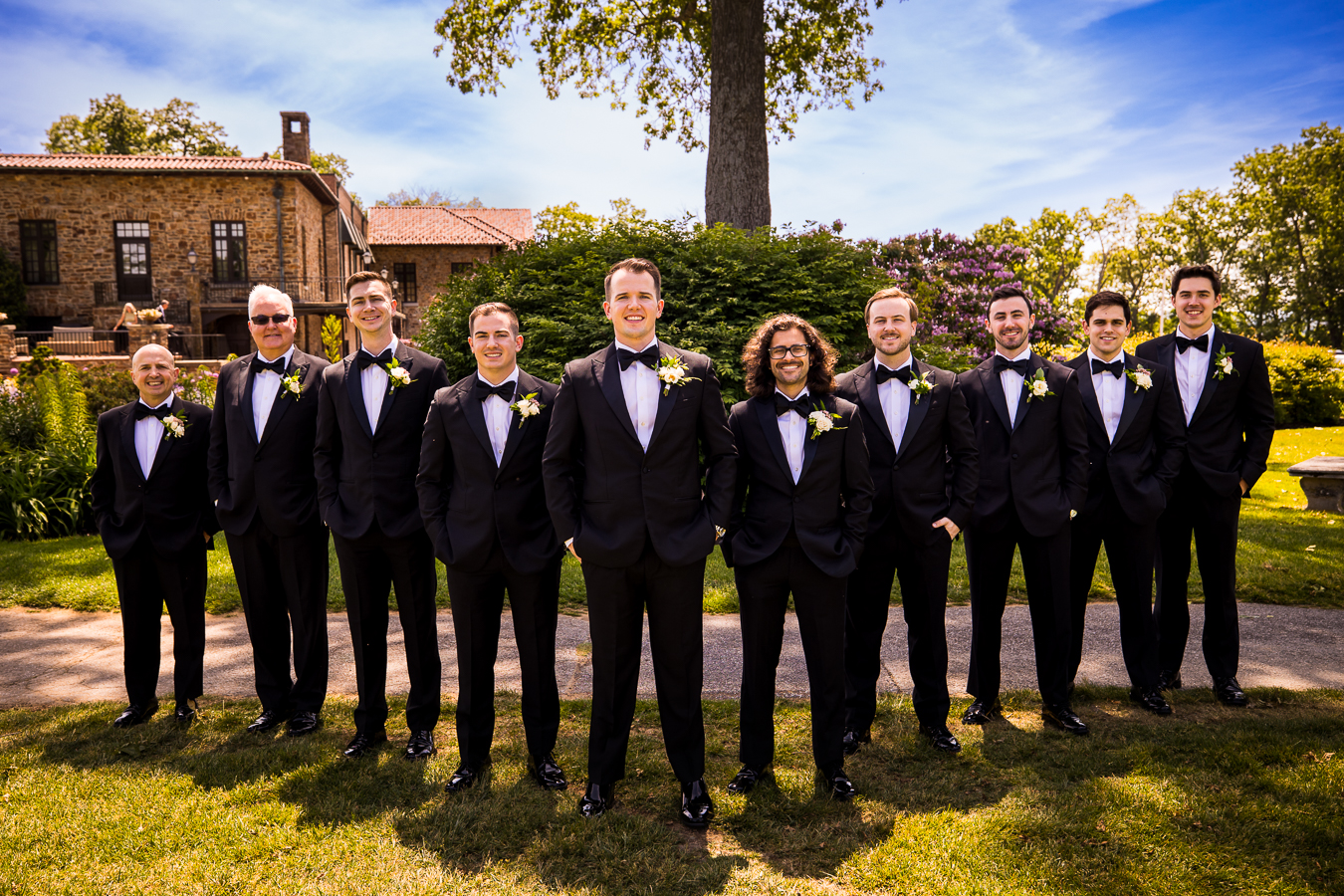pa wedding photographer, rhinehart photography, captures this traditional portrait of the groom and his groomsmen outside of the country club before the ceremony 