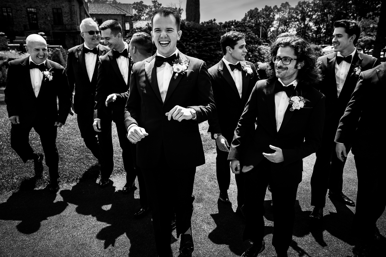 best pa wedding photographer, lisa rhinehart, captures this fun creative black and white image of the groom and his groomsmen laughing with one another 