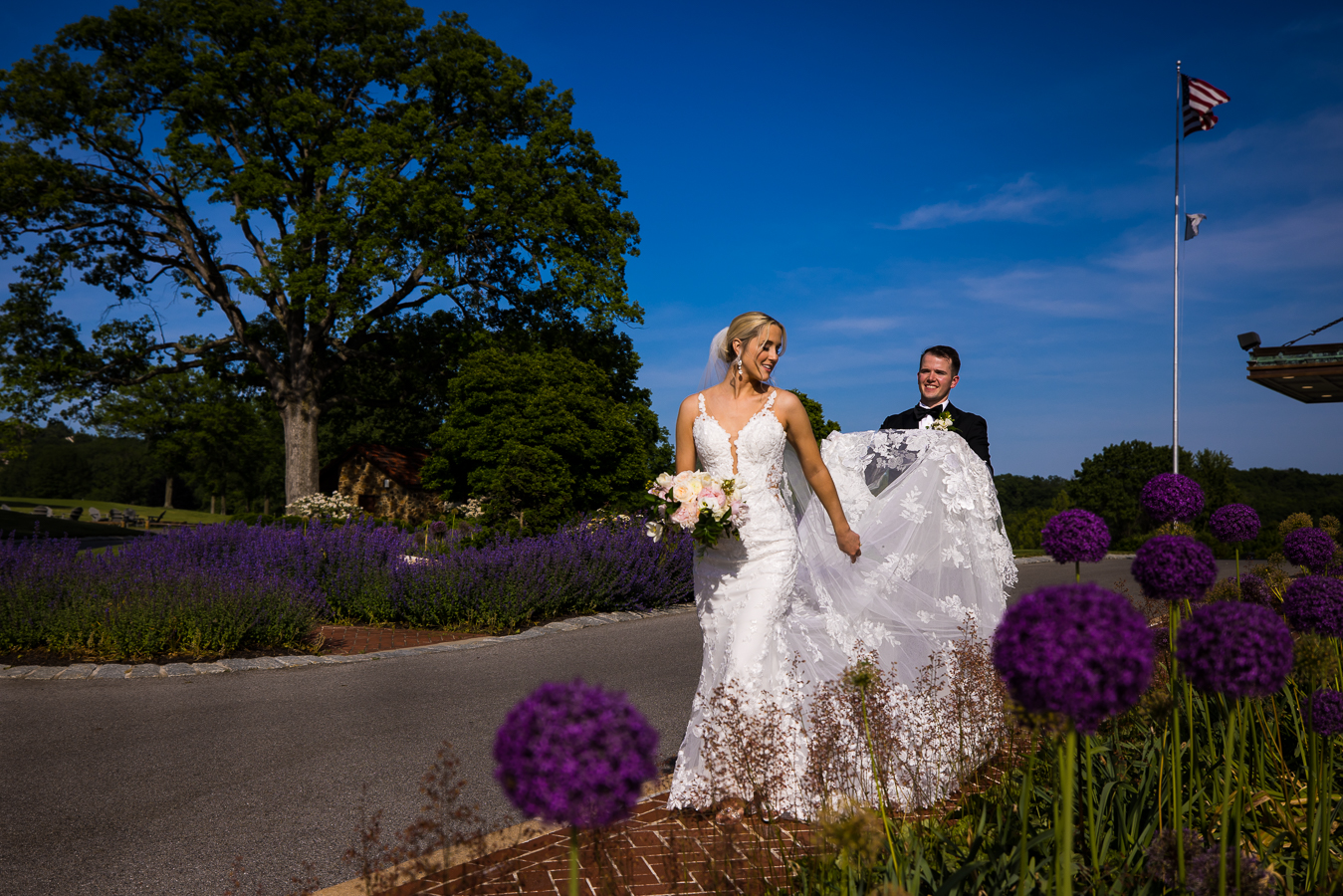 creative, colorful, vibrant image of the bride and groom exploring the country club of york together during their wedding portraits