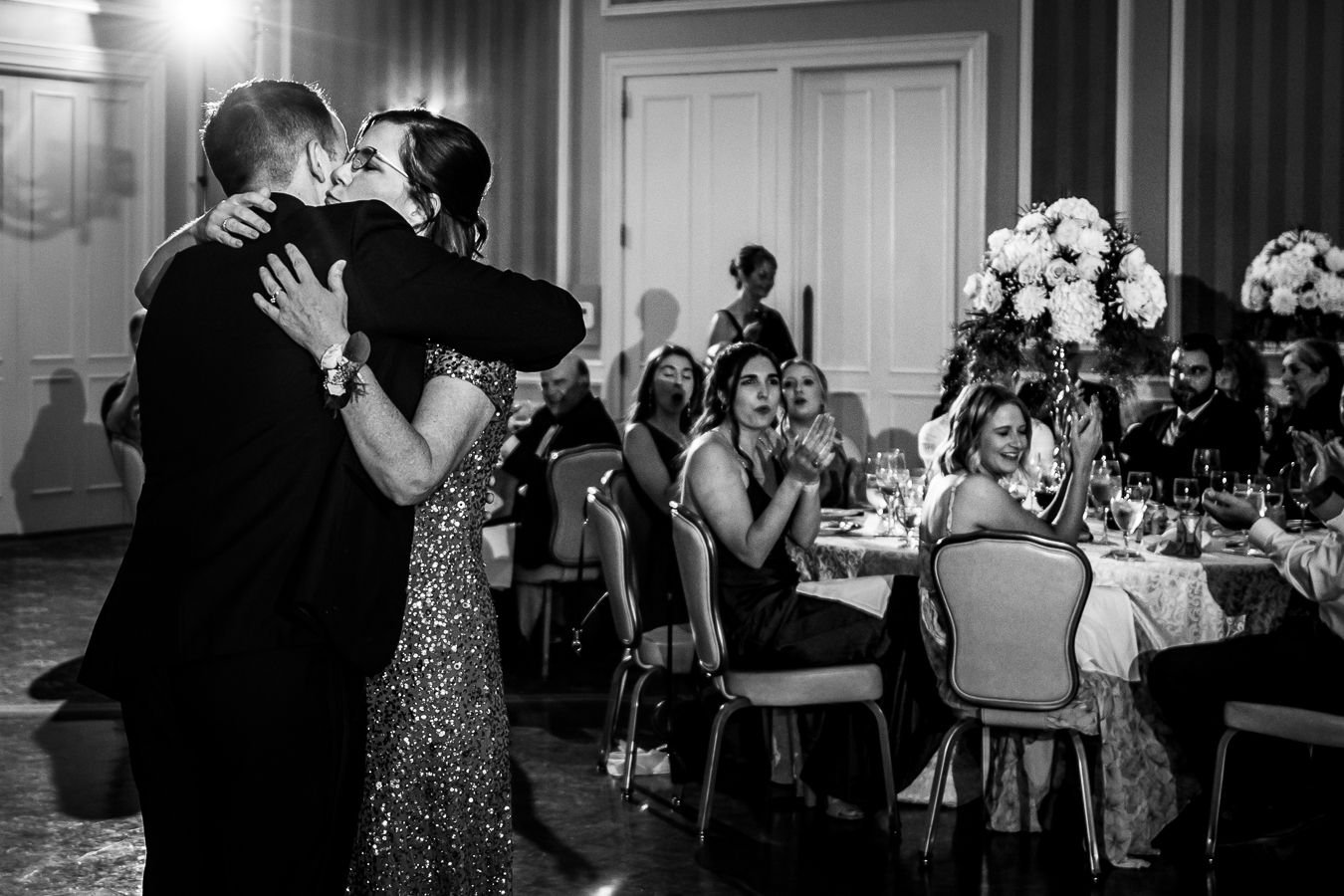 black and white image of the mother and groom hugging one another during their mother son dance at the Country Club of York