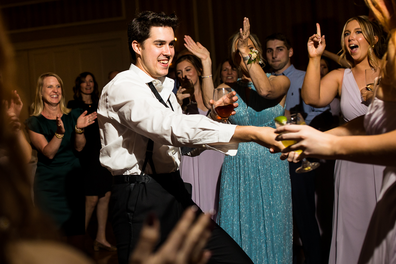 pa wedding photographer, lisa rhinehart, captures this fun dancing shots of guests having a good time at this country club of york wedding