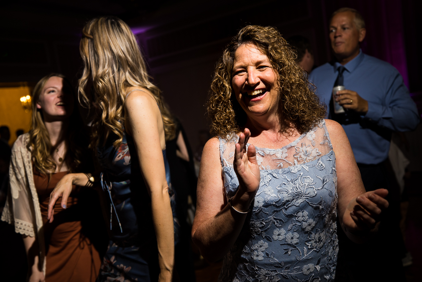 image of guests smiling and laughing while dancing at this york wedding reception