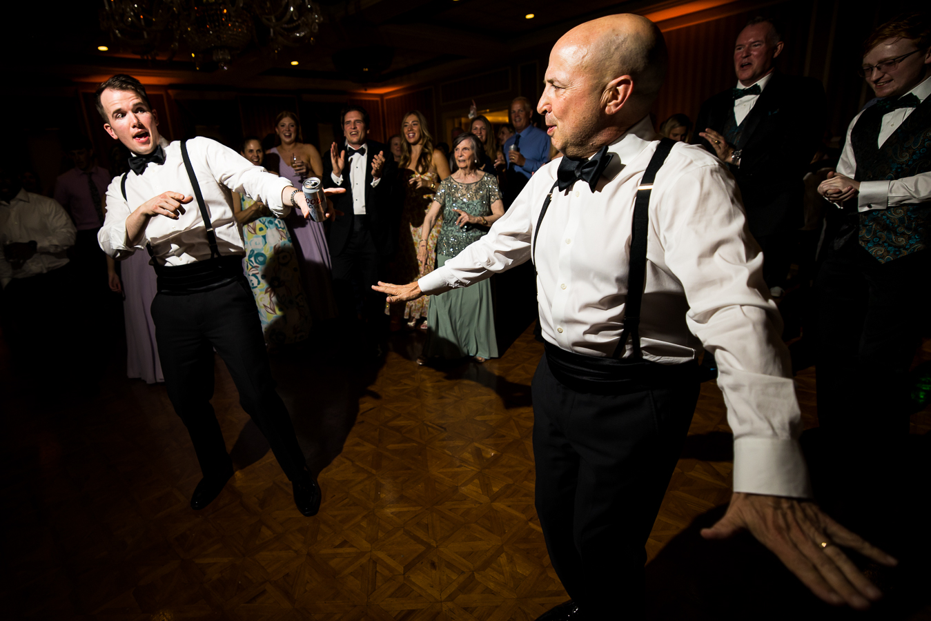 image of the groom and his dad dancing together on the dance floor