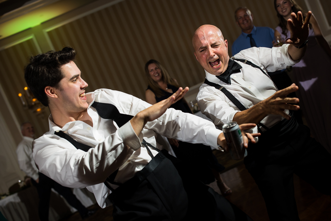 creative, fun wedding photographer, lisa rhinehart, captures this fun image of groomsmen and the dad dancing together and having a good time at this wedding reception in york