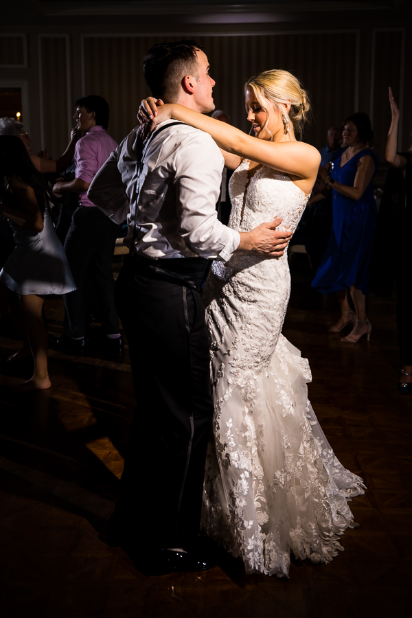 image of the bride and groom dancing with one another at their wedding reception 