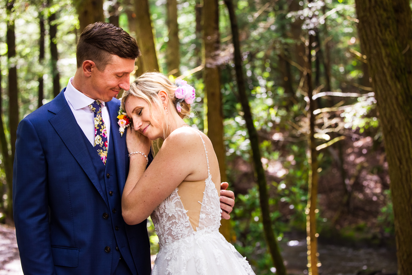 Jim Thorpe Wedding Photographer, lisa rhinehart, captures this vibrant, authentic, loving image of the bride and groom hugging one another and smiling as they stand beneath the trees in this pa hiking trail