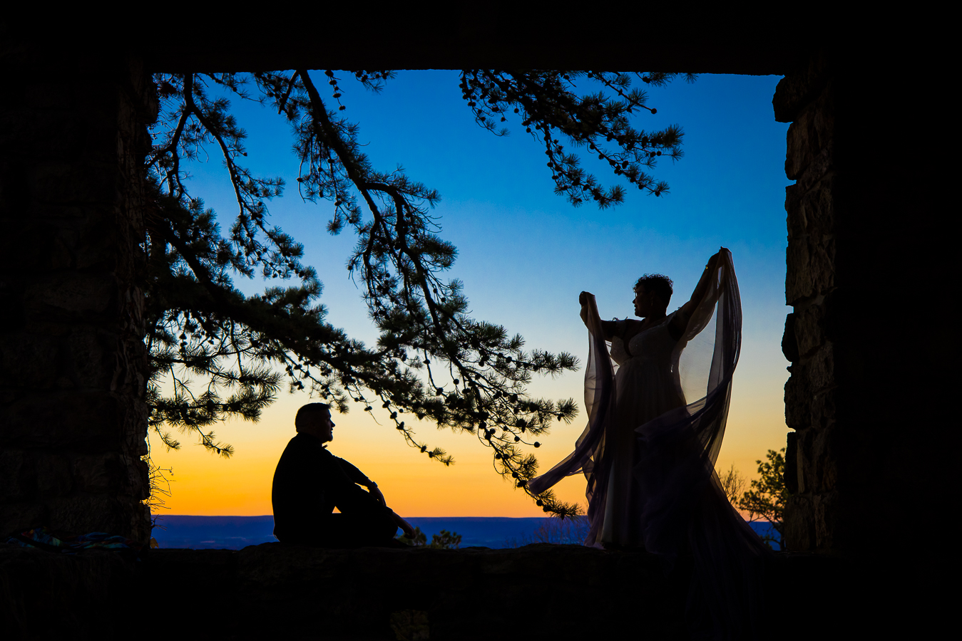washington dc LGBTQ Wedding Photographer, lisa rhinehart, captures this vibrant, colorful silhouette of this couple as they dance while watching the sunset at Kings Gap Mansion 