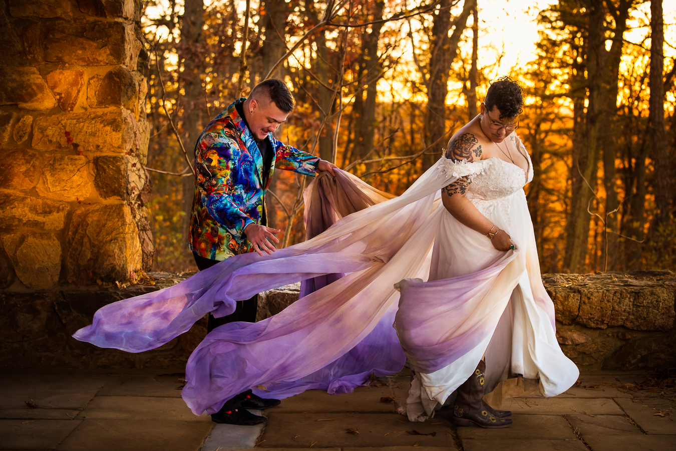 Kings gap mansion photographer, lisa rhinehart, captures this image of the couple as they are gathering the colorful dress up to head to next photo location 