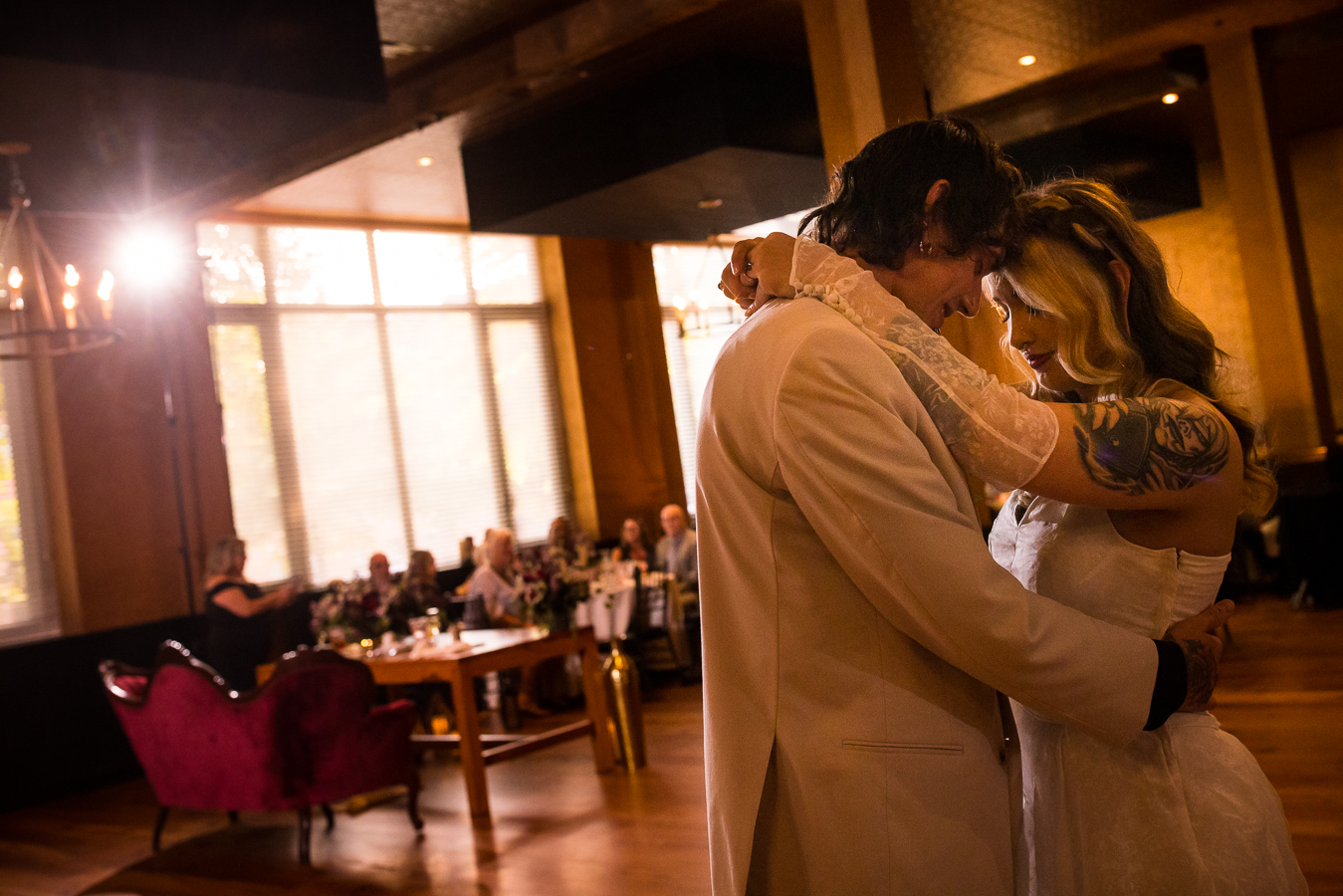 Cork Factory Hotel Wedding Photographer, rhinehart photography, captures the couple as they share their first dance together inside of the hotel during their wedding reception 