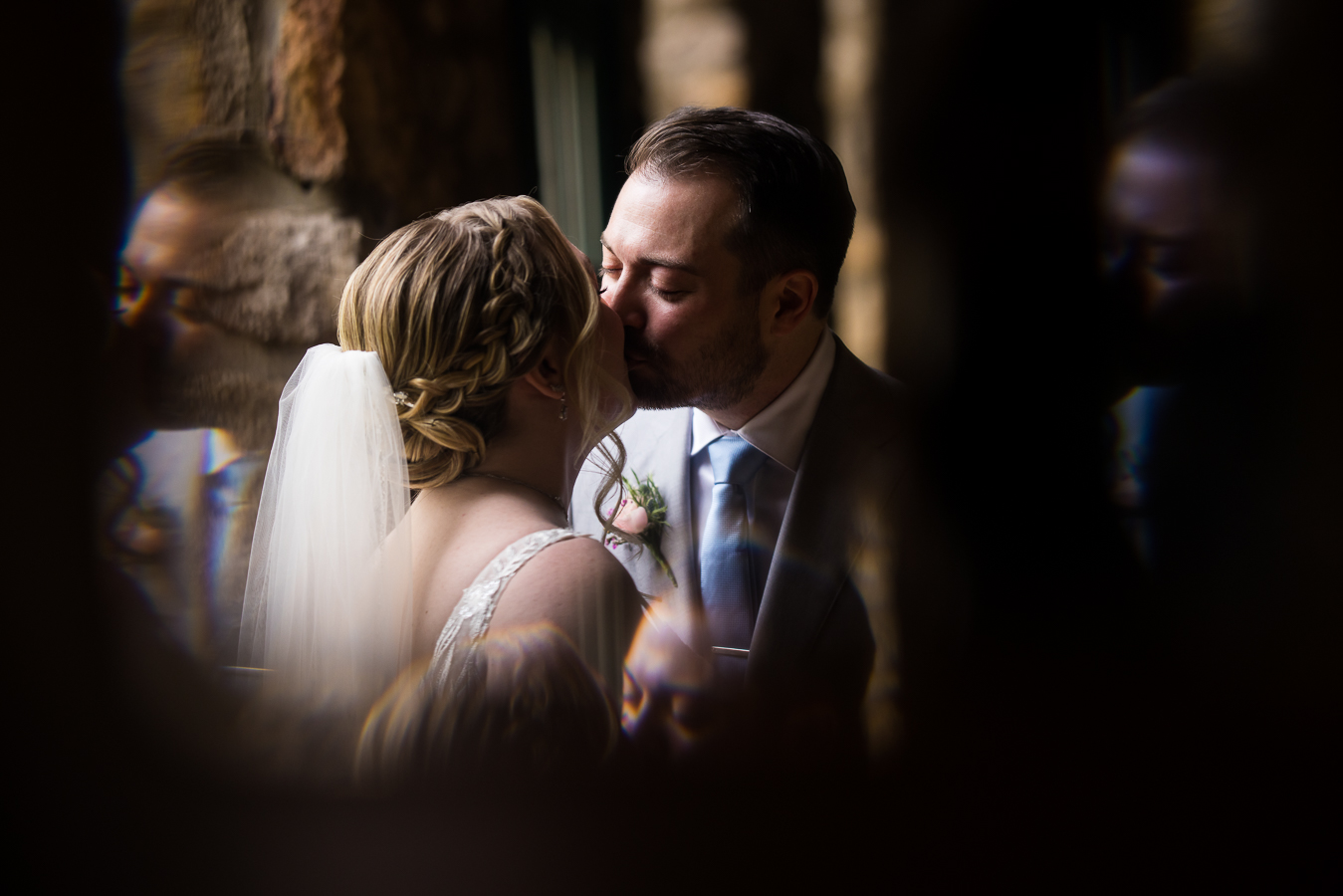 creative Holly Hedge Estate Wedding Photographer, rhinehart photography, captures this unique, creative romantic portrait image of the couple as they share a kiss caught through the glass on the piano 