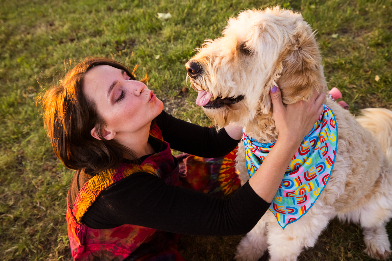 fun, playful image of the artist as she blows kisses towards her dog during this portrait session 