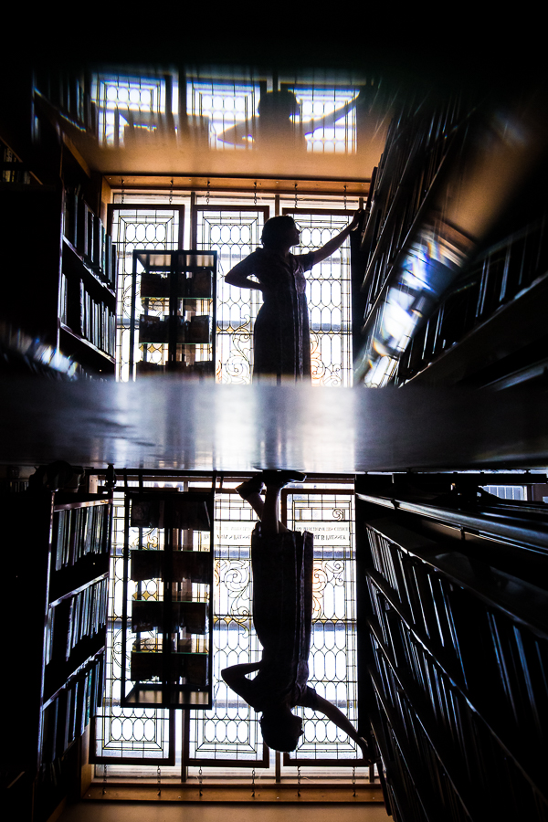 this Creative Harrisburg Photography session features this unique reflective image of this artistic senior as she explores this midtown scholar bookstore