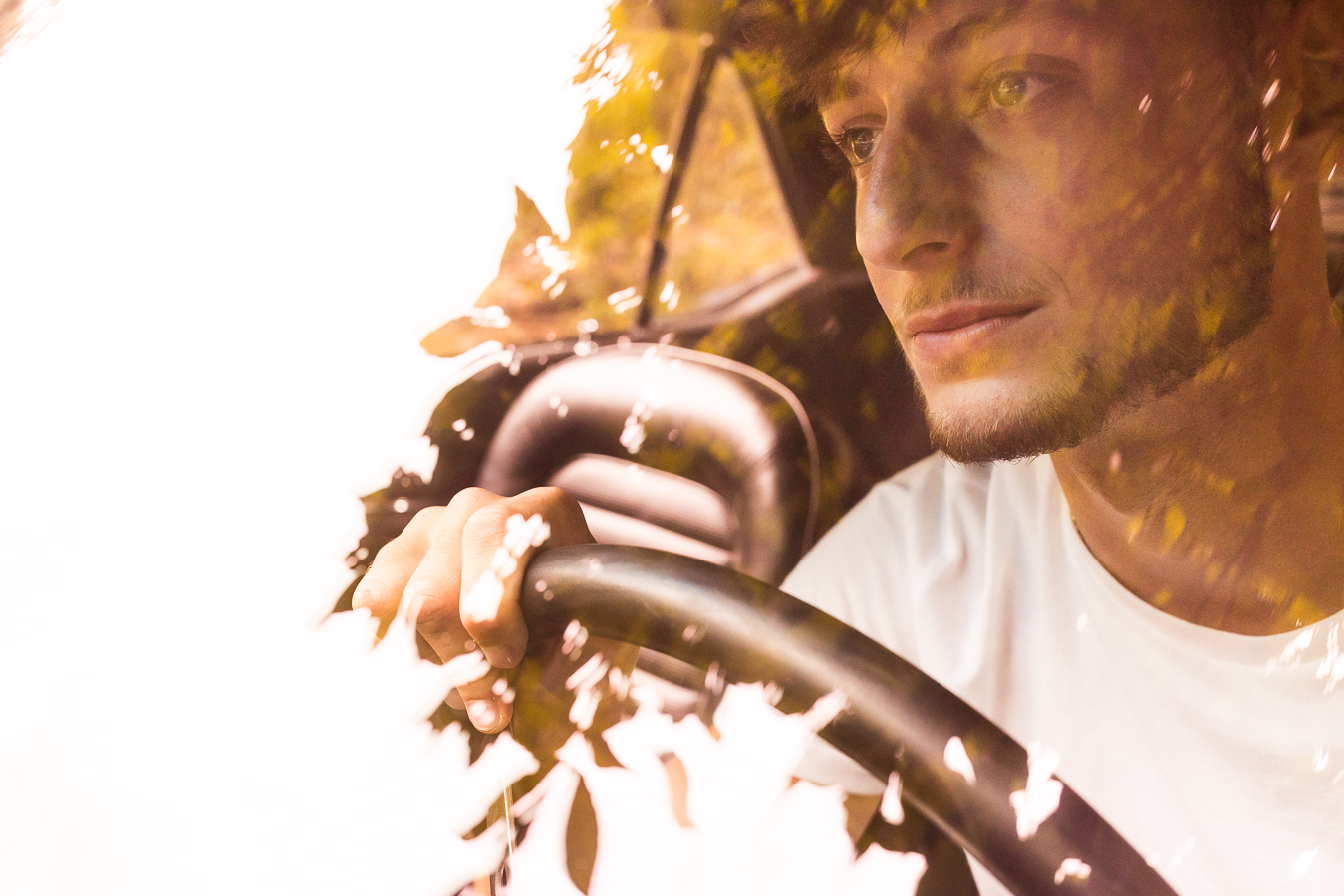 creative, unique image of this male as he sits in his 1966 mustang with the reflection of leaves and trees on the windshield taken by High school Senior Portrait Photographer, rhinehart photography 