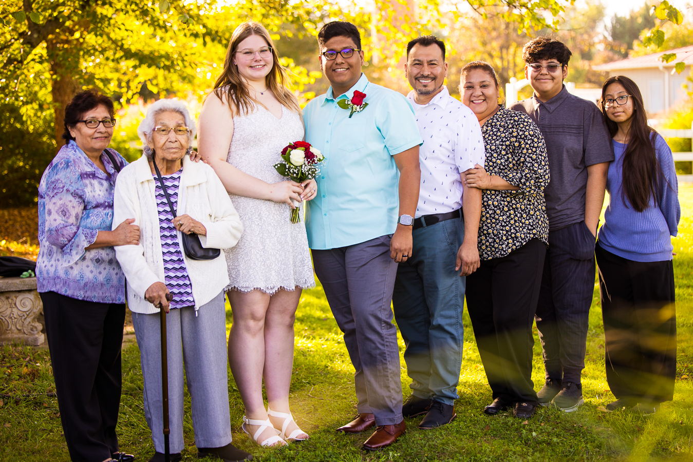 spencerville maryland family photographer, lisa rhinehart, captures this traditional family portrait of the couple with their family after their intimate wedding ceremony at the cedar ridge community church 